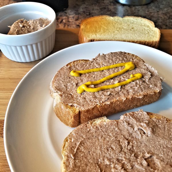 meat pate spread on toast with mustart